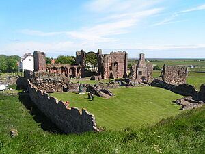 Ruins of Lindisfarne Priory and St Aidan's statue - geograph.org.uk - 189125