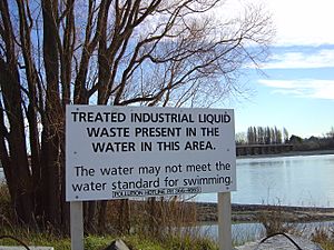 Water pollution sign on the Waimakariri River