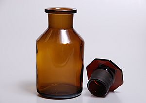Dark bottle with ground glass plug