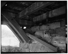 Detail view of truss, lower chord and arch ring bearing on stone abutment. - Leatherwood Station Covered Bridge, Spanning Leatherwood Creek (moved to Billie Creek Village), HAER IND,61-MONT,1-9