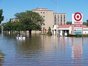 Residents boat down a main street in Munster, IN