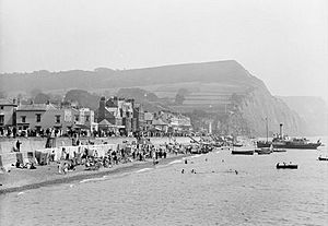 Seafront with paddle steamer beaching, Sidmouth, Devon