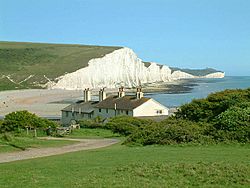 Seven Sisters cliffs and the coastguard cottages, from Seaford Head showing Cuckmere Haven (looking east - 2003-05-26)