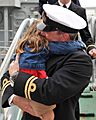 A Royal Navy Officer Hugs His Daughter After Returning from a Long Deployment on HMS Chiddingfold MOD 45153053