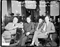 Cornelius P. Shea, John Miller, Fred Mader, and Tim Murphy sitting in a row in a courtroom