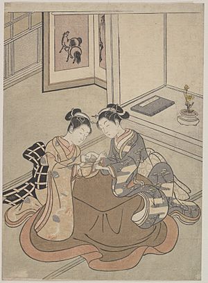 Mma two young women seated by a kotatsu playing cats cradle 55802