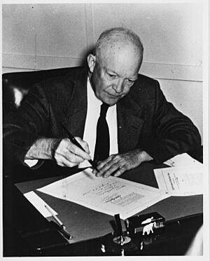 Photograph of President Dwight D. Eisenhower Signing the Civil Rights Act of 1957 (H.R. 6127) in His Office at the Naval Base in Newport, Rhode Island - NARA - 7865612