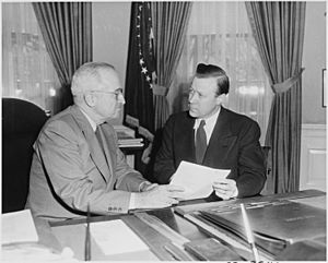 Photograph of President Truman in the Oval Office, conferring with labor leader Walter Reuther, president of the... - NARA - 200406