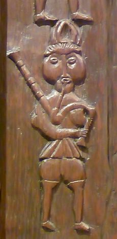 Bagpiper carving, c.1600