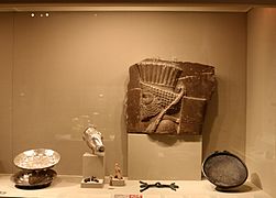 Museum display case showing Achaemenid objects.