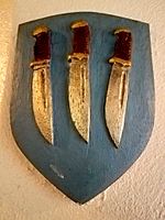 Shield showing three flaying knives, symbol of St. Bartholomew