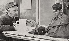 Sir Edmund Hillary discusses plans with Rear-Admiral George Dufek at Scott Base during the Commonwealth Trans-Antarctic Expedition, 1957