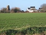 View across fields to disused windmill - geograph.org.uk - 649580.jpg