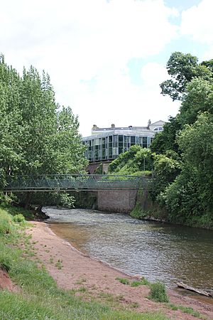 View of Monmouth Museum from Vauxhall Fields, including the river Monnow, Monmouth, Wales