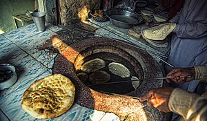 A Tandoor also known as tannour is a cylindrical clay or metal oven used in cooking and baking in Pakistan and other Asian countries