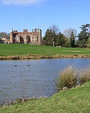 Across the lake to Madingley Hall (geograph 6402209 by John Sutton)