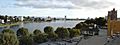 Panoramic photograph of the Lake Merritt Wild Duck Refuge, surrounded by the buildings of Oakland.