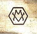 Metropolitan-Vickers Logo as engraved on a brass wavegude