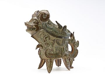 Ritual wine ewer (gong) with masks (taotie), dragons, and real animals