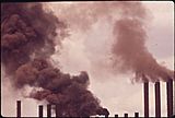 Smoke billows from a dozen industrial chimneys