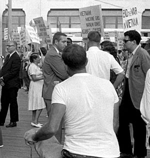 Demonstrators against the war in Vietnam holding signs on the boardwalk during the 1964 Democratic National Convention (cropped1)
