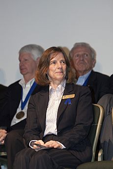KSC-2013-2074 Bonnie Dunbar listens as she is being introduced for induction into the U.S. Astronaut Hall of Fame