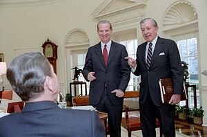 President Ronald Reagan talking to James Baker and Don Regan