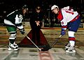 US Navy 081101-N-9898L-063 Capt. Patrick Hall, commanding officer of the aircraft carrier USS Abraham Lincoln (CVN 72), drops the ceremonial puck before a local hockey game