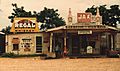 A cross roads store, bar, juke joint, and gas station in Melrose, Louisiana, 1944