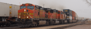 BNSF container train led by GE Dash 9-44CW locomotives at Winslow, Arizona