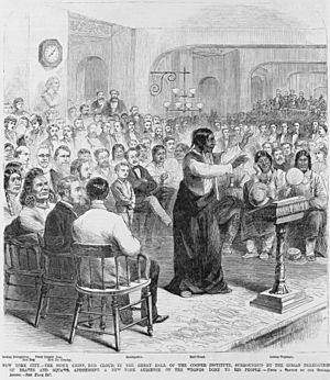 New York City - the Sioux Chief, Red Cloud, in the Great Hall of the Cooper Institute, surrounded by the Indian delegation of braves and squaws, addressing a New York audience on the wrongs LCCN93511308 (cropped)