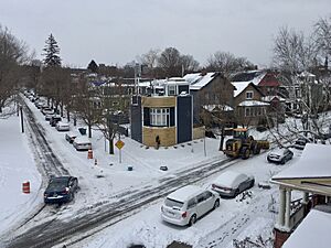 Snow removal via frontloader on Cottage Street after December 2019 winter storm, Buffalo, New York - 20191211