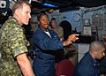 US Navy 080727-N-9493W-004 Air Traffic Controller 1st Class Erica Banks explains the SPN 43 Radar System