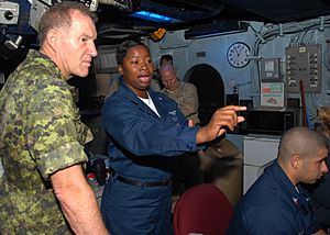 US Navy 080727-N-9493W-004 Air Traffic Controller 1st Class Erica Banks explains the SPN 43 Radar System