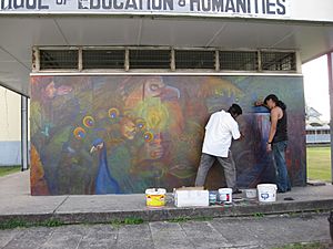 George Simon and Anil Roberts at work on Palace of the Peacock mural