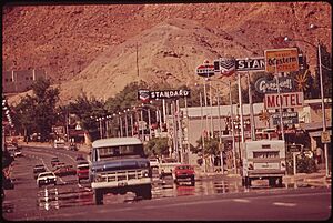 MAIN STREET OF MOAB. TRAFFIC IS BEGINNING TO BRING POLLUTION PROBLEMS TO A REGION LONG NOTED FOR THE CRYSTAL CLARITY... - NARA - 545618