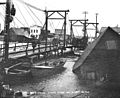 Snake River Bridge and destruction caused by a storm, Nome, Alaska, October 1902 (HEGG 15)