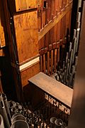 Casavant Frères ranks of round, grey metal pipes and square wooden pipes of all sizes inside the organ.