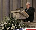 Kissinger speaking during Ford's funeral