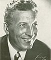 Publicity portrait of a man in his mid-fifties with curly hair (Pinza)