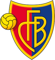 FC Basel crest of a shield, the left half red and the right half blue. The shield is outlined with gold and in the centre in gold letters it reads "FCB". On the left side of the logo is a gold football.