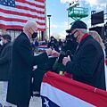 Joe Biden and Tom Carper fist bumping at Biden's farewell address in Delaware
