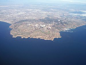 Aerial view of the Palos Verdes Peninsula and the Palos Verdes Hills, with Los Angeles in the distance