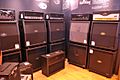A selection of Peavey amplifier head units and speaker cabinets are shown.