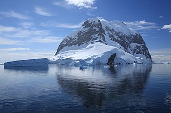 Icebergs and Booth Island, Antarctica (6062693592).jpg
