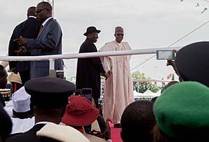 Incoming and Outgoing Nigerian Presidents Wave to Crowd Amid Peaceful Inaugural in Abuja