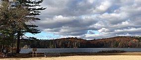 Paugnut State Forest's hills in autumn viewed from the north-east shore of Burr Pond.jpg