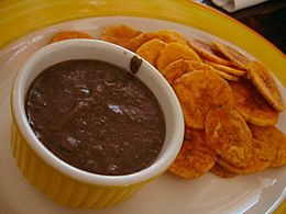 A bean dip served with plantain chips