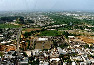 Aerial view of Bayamón, with the Universidad Metropolitana spanning the highway