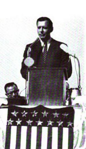 Carl Sanders at podium